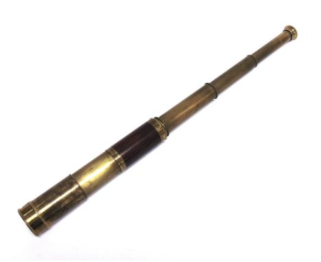 A BRASS THREE-DRAW POCKET TELESCOPE  unsigned, with a mahogany main body, an extending objective lens guard and removable len