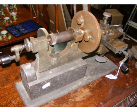 A jeweller's miniature lathe with tools