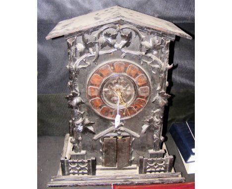 A large 19th century carved Black Forest musical cuckoo clock playing on bells and bellows - 60cm high