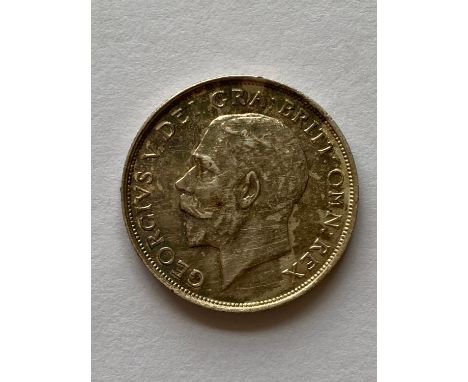 A George V Shilling, bare head l, lion passant on crown, dated 1911.  *CR:  Good condition with light toning.  *BP 22.5% (18.