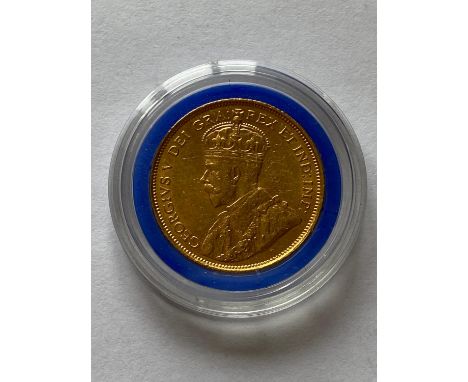 A Canadian George V 5 Dollar Gold coin dated 1912, crowned bust l. reverse with shield within maple leaves.  *CR:  In capsule