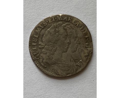 A William and Mary Sixpence dated 1693, conjoined busts r. Crowned cruciform shield with WM to the angles.  *CR:  Rubbing to 