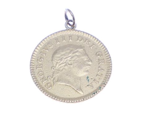 A George III third Guinea, laureate bust r. Crown with date 1804 to reverse. With suspension loop attached at the top. 2.84g.