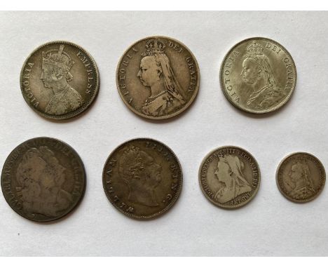 A small collection of 17th, 18th and 19th century silver: A William and Mary Halfcrown dated 169_, A William IV East India Co