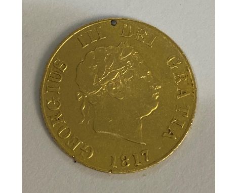 A George III Sovereign, laureate head r., crowned shield reverse. Dated 1817.  *CR:  Slightly worn. Slight edge marks from pr