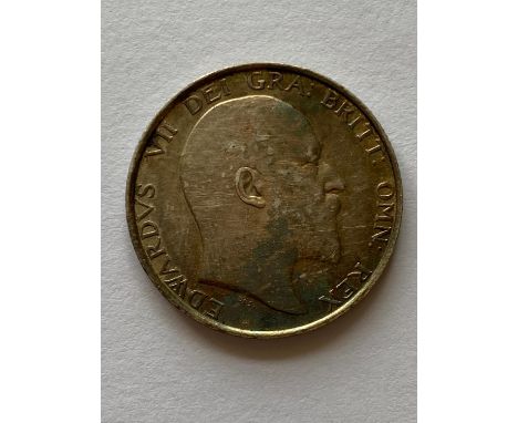 An Edward VII Shilling, bare head r, lion passant on crown, dated 1902.  *CR:  Good condition with attractive light toning.  