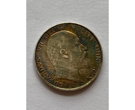 An Edward VII Shilling, bare head r, lion passant on crown, dated 1902.  *CR:  Good condition with attractive light toning.  