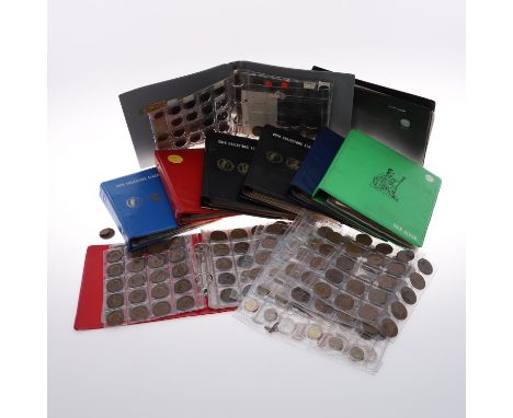 A collection of nine coin albums and loose pages containing mostly predecimal Great Britain Coinage for George V and George V