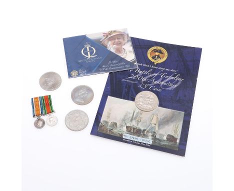 A Royal Mint Queen's Diamond Jubilee £5.00 coin, Trafalgar £5.00 coin and three commemorative crowns. With a pair of miniatur