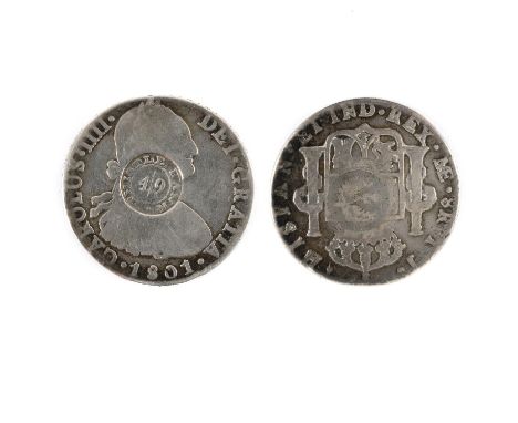 A Mexican 8 Reales coin, Charles IV, r, Crowned shield between pillars, dated 1901, ME. countermarked Thistle Bank around 4/9