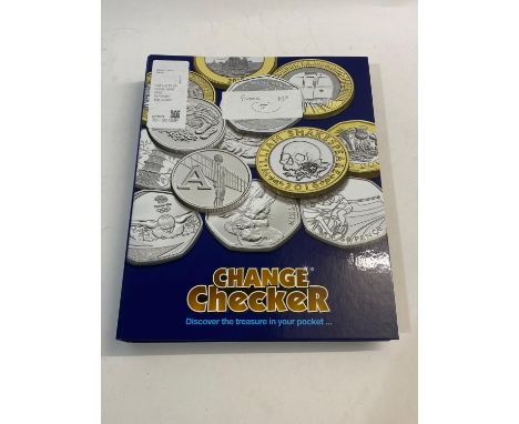 An album containing a set of the 26 uncirculated 'early strike' Alphabet 10 pence pieces mounted in 'Change Checker' mounts, 