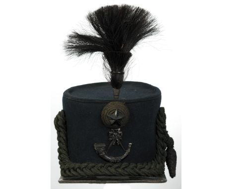 A Cameronians or Scottish Rifles Shako, the black body with leather trim, blackened brass strung bugle horn, black cord boss 