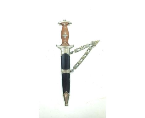 A German NSKK chained dagger, 21.75cm flattened diamond section blade marked with the motto and RZM 7/66 1940, regulation hol