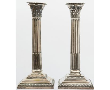 A pair of silver Corinthian column candlesticks, Sheffield 1892 by Goldsmiths and Silversmiths Co. (William Gibson and John L