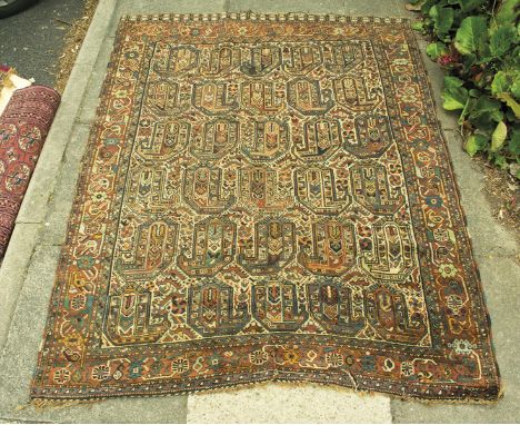 A Turkish Afshar rug, the ivory field with boteh, birds and flower-heads, turtle vine and flower head border within two guard