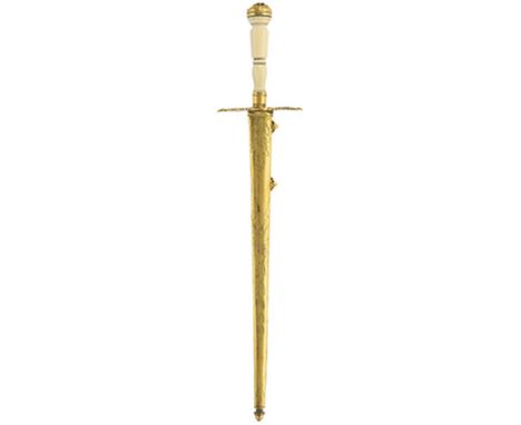 A Georgian Naval Officer's dirk, 25cm flattened diamond section fullered blade, gilt hilt with leaf form crossguard, turned i