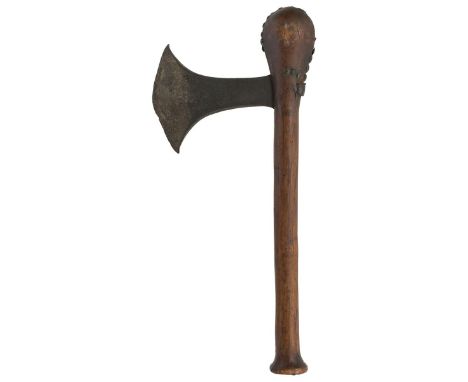 A 19th Century Songye tribal axe, 11.5cm edge with raised and chiselled edges, further incised wavy line and dot decoration, 