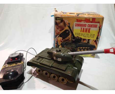Lincoln Command control tank, battery operated, flashing gun, one tank track snapped, control unit with tape repair, box is i