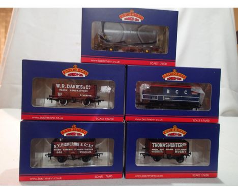 Four OO gauge Bachmann Collectors Club wagons, 2009K, 2010K, 2011K and 300K, 15th anniversary brake van. Also includes 37-575