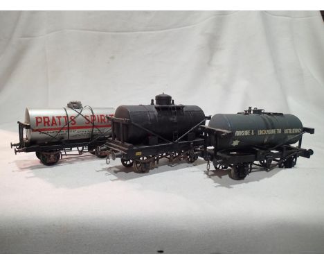 Three OO gauge kit built tanker wagons, Pratts Spirit, Yorks and Lincs, tar, plain black- unnamed, all finished as well used/