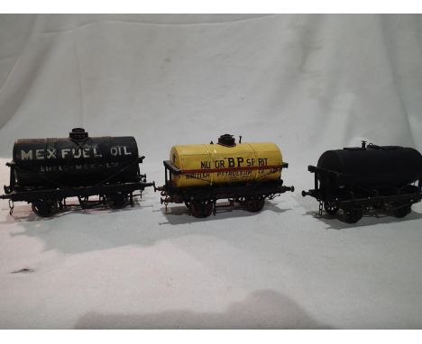 Three O gauge kit built tanker wagons, Mex fuel oil, BP and black unnamed, finished as well used/weathered condition. UK P&am