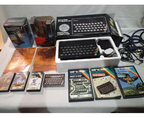 ZX Sinclair Spectrums, boxed with manual, leads etc, plus quick shot one and two joysticks and seven games with cassette and 