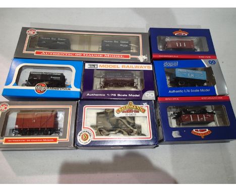 Eight OO scale assorted wagons, Bachmann, Dapol etc includes Dapol Helston Gas company twin set mostly in excellent condition