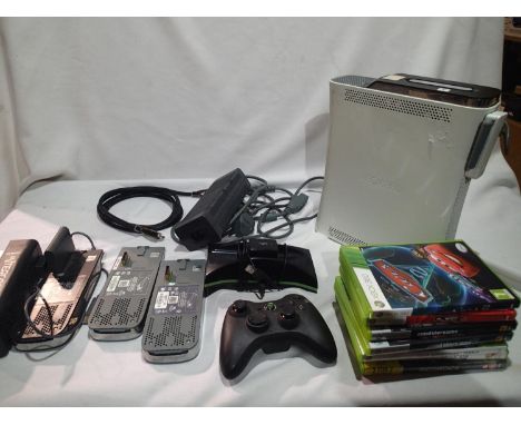 Xbox 360 console plus three extra hard drives, power pack, controller and seven games. UK P&amp;P Group 2 (£20+VAT for the fi