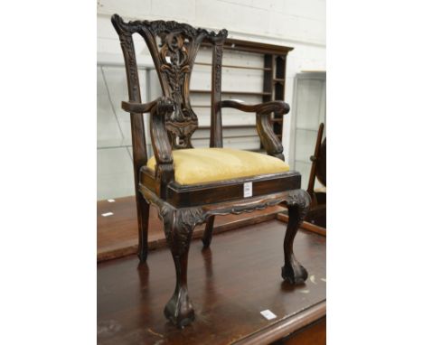 A miniature Chippendale style carved mahogany armchair.