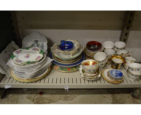 A shelf of decorative china.