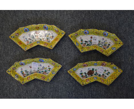 A set of four Canton enamel fan shaped dishes.