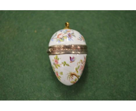 A small enamel egg shaped pomander.
