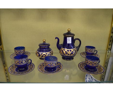 A blue glass and gilt decorated part tea service.