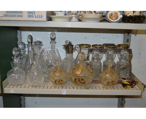 A shelf of glassware to include a tantalus.