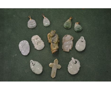 A collection of Chinese carved jade amulets and pendants.