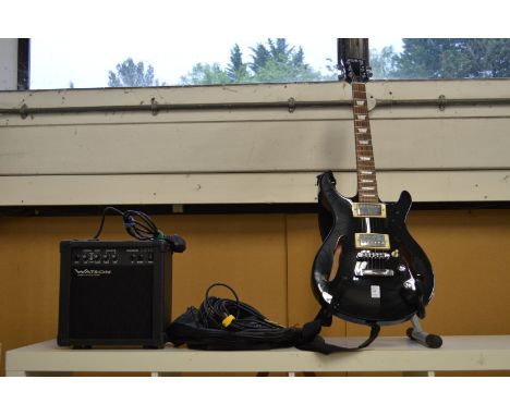 An Alba electric guitar with a Watson amplifier and accessories.