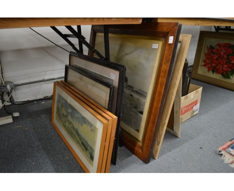 A maple framed photographic print of a shipwreck and various other pictures.