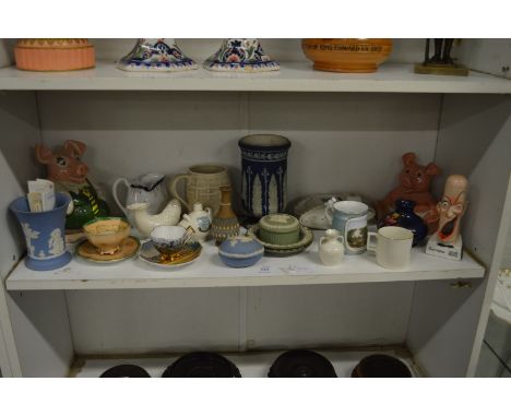 A shelf of decorative china.