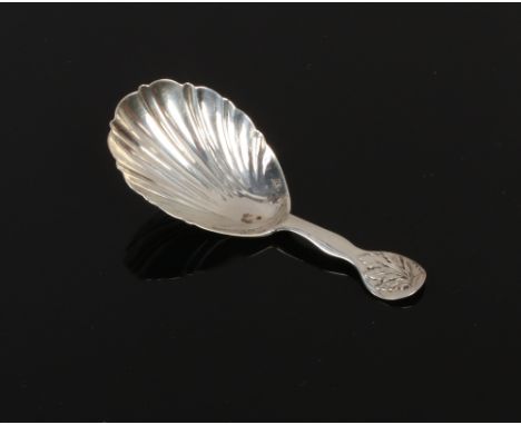 A victorian silver caddy spoon with shell shaped bowl and leaf terminal, assayed Exeter 1849.