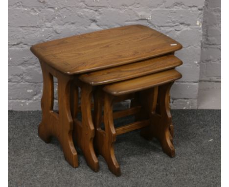 A nest of three Ercol Golden Dawn occasional tables.