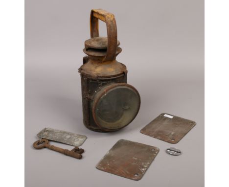 A collection of railway items, railway lantern, wagon plates, badge, LNER railway key.