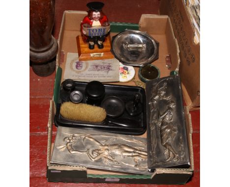 A box of collectables to include Toby Bitters advertising figures, vintage Police whistle, ebonised dressing table set, wall 