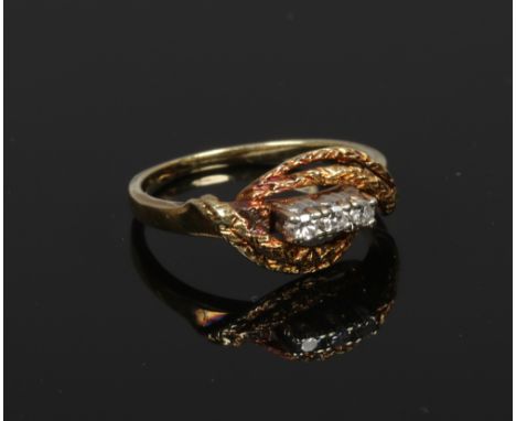 A 14ct gold and three diamond stone ring, size K.