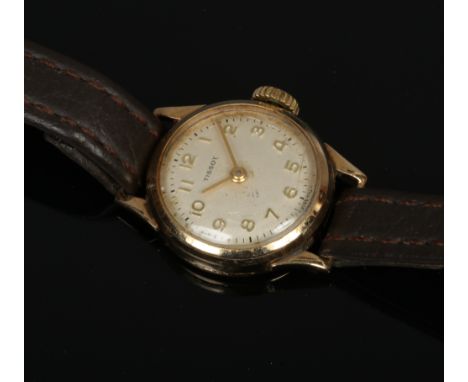 A ladies 9ct gold Tissot manual wristwatch head on leather strap, satin dial and Arabic numeral markers.Condition report inte