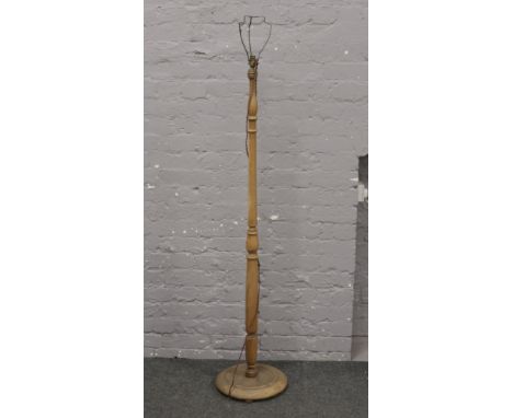 A turned oak standard lamp.