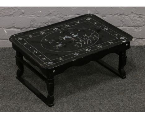 A mother of pearl inlaid and lacquered folding bed tray.