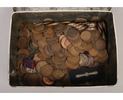 A vintage CWS tin and contents of mainly English pre-decimal coins.