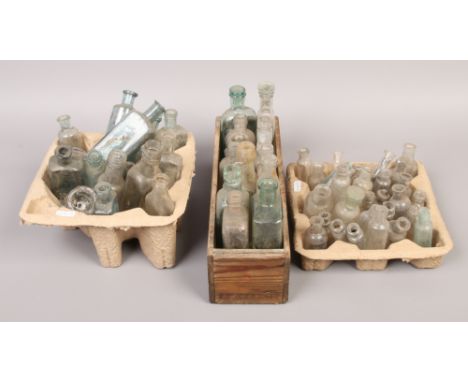 A collection of vintage glass storage bottles.