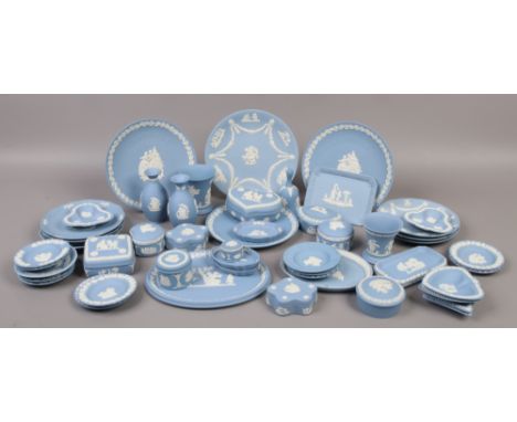 A quantity of blue Wedgwood Jasperware to include trinket boxes, vases, cabinet plates etc, approximately 50 pieces.