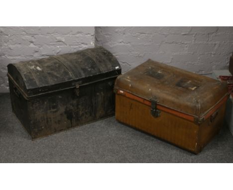 Two vintage tin twin handle trunks.